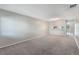 Spacious living room with lots of neutral paint and carpet at 1230 Americana Pl, Orlando, FL 32807