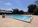 Large community swimming pool with lounge chairs and clear blue water, perfect for relaxation and recreation at 1230 Americana Pl, Orlando, FL 32807