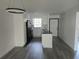 Bright kitchen with white cabinets, black appliances, and island at 1250 S Denning Dr # 108, Winter Park, FL 32789