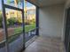 Screened porch with neutral tile floors with outside views at 1250 S Denning Dr # 108, Winter Park, FL 32789