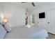 Comfortable bedroom with adjacent bathroom and closet, and bright neutral decor at 1375 Tuscana Ln # 1102, Davenport, FL 33896