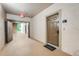 Hallway showing apartment entrance doors with neutral walls and flooring at 1375 Tuscana Ln # 1102, Davenport, FL 33896