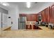 Stylish kitchen with granite countertops, stainless steel appliances, and ample cabinet space at 1375 Tuscana Ln # 1102, Davenport, FL 33896