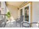 Screened in porch with table and chairs and french doors to the interior at 1375 Tuscana Ln # 1102, Davenport, FL 33896