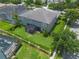 Aerial view of the property showcasing the spacious backyard, screened lanai, and well-maintained landscaping at 14357 United Colonies Dr, Winter Garden, FL 34787