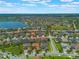 Aerial view of the community and scenic lake, with a locator pinpointing a home within the neighborhood at 14357 United Colonies Dr, Winter Garden, FL 34787