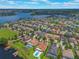 Aerial view of a lakeside community featuring a neighborhood with beautiful homes, and scenic waterfront views at 14357 United Colonies Dr, Winter Garden, FL 34787