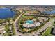 Bird's-eye view of a Primary-planned community with a clubhouse, pool, and lake, surrounded by residential homes at 14357 United Colonies Dr, Winter Garden, FL 34787