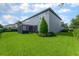 Expansive backyard featuring lush green lawn and screened lanai for outdoor enjoyment at 14357 United Colonies Dr, Winter Garden, FL 34787