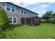 Backyard featuring lush green lawn, screened in patio, and view of the home's exterior at 14357 United Colonies Dr, Winter Garden, FL 34787