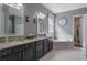 Bathroom with granite countertop, double vanity, and tub at 14357 United Colonies Dr, Winter Garden, FL 34787