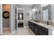 Bathroom featuring a granite countertop, double vanity, and tile floor at 14357 United Colonies Dr, Winter Garden, FL 34787