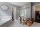 Bright bathroom with glass-enclosed shower, tub and walk-in closet at 14357 United Colonies Dr, Winter Garden, FL 34787
