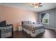Inviting bedroom featuring a stylish bed, a crib, and a neutral color scheme for relaxation and comfort at 14357 United Colonies Dr, Winter Garden, FL 34787