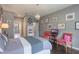 Comfortable bedroom with hardwood floors, chandelier lighting, and charming decor create a cozy atmosphere at 14357 United Colonies Dr, Winter Garden, FL 34787