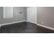 Empty bedroom with hardwood flooring, large closet, and window at 14357 United Colonies Dr, Winter Garden, FL 34787