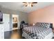 Bedroom featuring a stylish bed, a crib, and hardwood flooring, creating a comfortable retreat at 14357 United Colonies Dr, Winter Garden, FL 34787