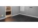 Empty bedroom with hardwood flooring and adjacent bathroom at 14357 United Colonies Dr, Winter Garden, FL 34787