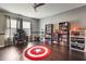 Bonus room or office space with desk, shelving, and hardwood flooring at 14357 United Colonies Dr, Winter Garden, FL 34787