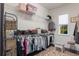 Walk-in closet with shelving, hanging racks, and window at 14357 United Colonies Dr, Winter Garden, FL 34787