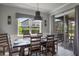 Elegant dining area with large windows and sliding glass doors to the outdoor patio at 14357 United Colonies Dr, Winter Garden, FL 34787