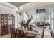 Elegant dining room with wood floors and wainscoting, adjacent to staircase at 14357 United Colonies Dr, Winter Garden, FL 34787
