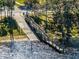 Wooden community dock with stairs providing access to the lake, creating a scenic waterfront experience at 14357 United Colonies Dr, Winter Garden, FL 34787