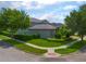 Attractive corner lot features lush landscaping, mature trees, and a well-maintained lawn at 14357 United Colonies Dr, Winter Garden, FL 34787