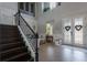 Elegant foyer boasts soaring ceilings, a staircase, and stylish decor at 14357 United Colonies Dr, Winter Garden, FL 34787