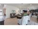Open concept living room featuring wood-look tile floors and seamless access to the kitchen at 14357 United Colonies Dr, Winter Garden, FL 34787
