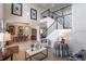 Spacious living room showcases a staircase, hardwood floors, and ample natural light at 14357 United Colonies Dr, Winter Garden, FL 34787