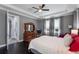 A bright main bedroom showcases a window view and a dark wooden dresser at 14357 United Colonies Dr, Winter Garden, FL 34787