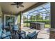 Covered patio with hot tub, seating area, and view of the backyard at 14357 United Colonies Dr, Winter Garden, FL 34787