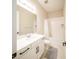 Bright bathroom with a single vanity, neutral tile, and bathtub with shower at 16055 Silver Brook Way, Winter Garden, FL 34787