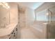 Beautiful bathroom featuring double sinks, soaking tub, and glass shower at 16055 Silver Brook Way, Winter Garden, FL 34787