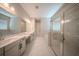 Bright bathroom with double vanity, soaking tub, glass shower, and modern fixtures at 16055 Silver Brook Way, Winter Garden, FL 34787