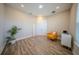 Bright bedroom with natural light, wood floors, and double-door closet at 16055 Silver Brook Way, Winter Garden, FL 34787