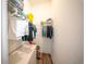 Walk-in closet with clothes hanging on a rack, shelf storage, and wood-look flooring at 16055 Silver Brook Way, Winter Garden, FL 34787