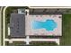 Bird's eye view of the community pool with lounge chairs and manicured lawns and landscaping at 16055 Silver Brook Way, Winter Garden, FL 34787