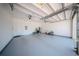 Clean garage space with speckled floor at 16055 Silver Brook Way, Winter Garden, FL 34787