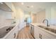 Modern kitchen with stainless steel appliances, white cabinets, and a spacious island at 16055 Silver Brook Way, Winter Garden, FL 34787