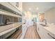 Modern kitchen with stainless steel appliances, white cabinets, and a spacious island at 16055 Silver Brook Way, Winter Garden, FL 34787