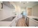 Modern kitchen with stainless steel appliances, white cabinets, and a spacious island at 16055 Silver Brook Way, Winter Garden, FL 34787