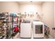 Well-equipped laundry room with modern appliances and storage solutions for convenience at 16055 Silver Brook Way, Winter Garden, FL 34787