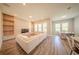 Bright living room with hardwood floors, recessed lighting, and a large window offering plenty of natural light at 16055 Silver Brook Way, Winter Garden, FL 34787