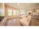 Bright living room featuring hardwood floors, recessed lighting, and an open concept layout at 16055 Silver Brook Way, Winter Garden, FL 34787