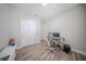 Modern office space featuring wood floors, closet, and minimalist decor at 16055 Silver Brook Way, Winter Garden, FL 34787