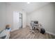 Modern office space featuring wood floors, closet, and minimalist decor at 16055 Silver Brook Way, Winter Garden, FL 34787