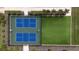 An aerial shot of well-maintained tennis and recreation courts with manicured landscaping and benches at 16055 Silver Brook Way, Winter Garden, FL 34787