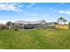 Spacious backyard featuring a manicured lawn and patio area at 1616 Golden Poppy Ct, Orlando, FL 32824